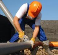 Plumber in Queen Creek working on larger pipe